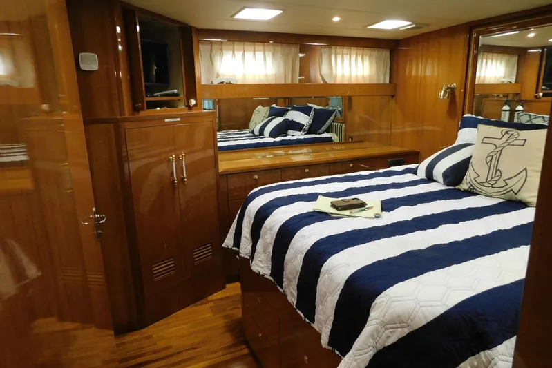 Liquid Gold Yacht Photos Pics Luxurious cabin interior of 2001 Jefferson Pilothouse 57 yacht with nautical decor.