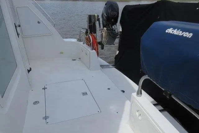  Yacht Photos Pics 2008 Carver 47 Motor Yacht deck with covered equipment and water view.