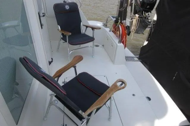  Yacht Photos Pics Deck seating area on a 2008 Carver 47 Motor Yacht with two chairs.