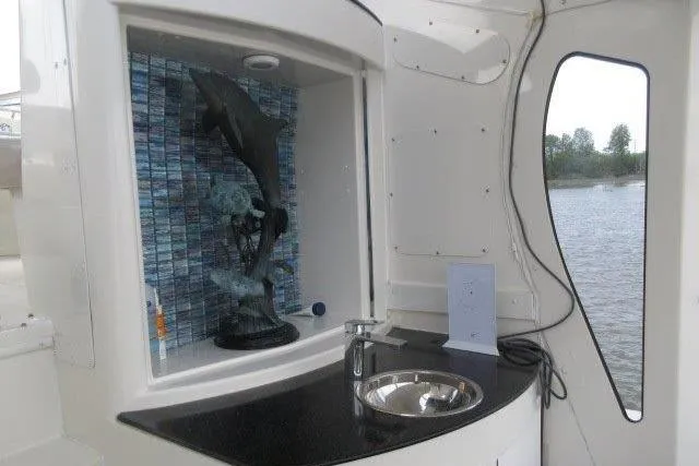  Yacht Photos Pics 2008 Carver 47 Motor Yacht interior with sink and dolphin sculpture.