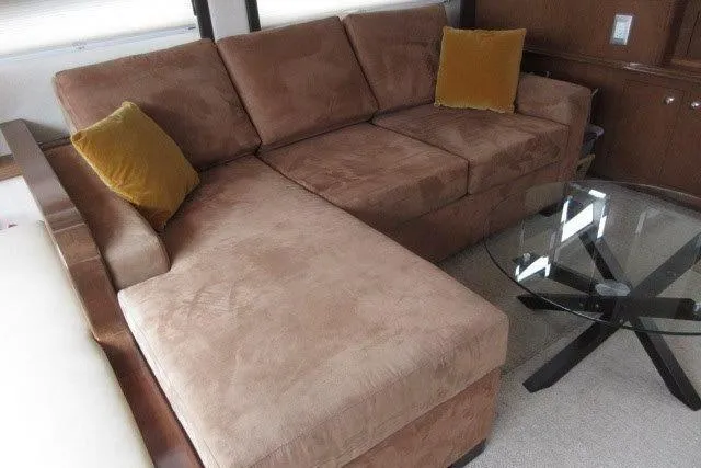  Yacht Photos Pics Brown sectional sofa with yellow cushions and glass coffee table in Carver 47 Motor Yacht, 2008.