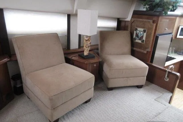  Yacht Photos Pics Interior of 2008 Carver 47 Motor Yacht with beige chairs and a lamp.