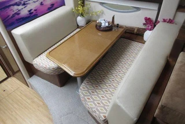  Yacht Photos Pics Interior of 2008 Carver 47 Motor Yacht with dining area and floral decor.