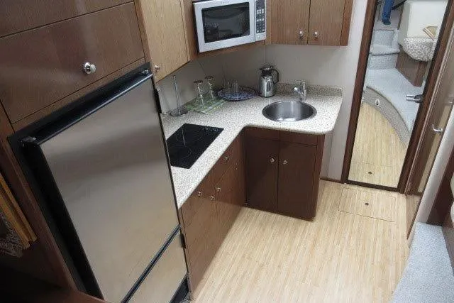  Yacht Photos Pics 2008 Carver 47 Motor Yacht kitchen with modern appliances and wood cabinetry.