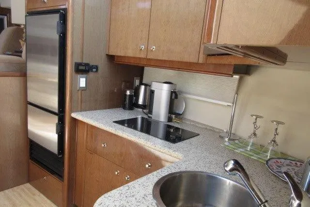  Yacht Photos Pics 2008 Carver 47 Motor Yacht kitchen with modern appliances and sleek countertops.
