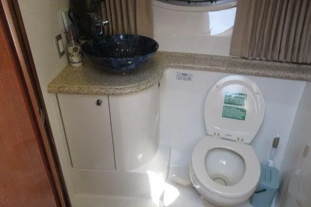  Yacht Photos Pics Bathroom interior of 2008 Carver 47 Motor Yacht with modern sink and toilet.