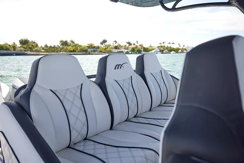 Devenzo Yacht Photos Pics Luxurious seating on 2022 Midnight Express 43 Open boat with scenic water view.