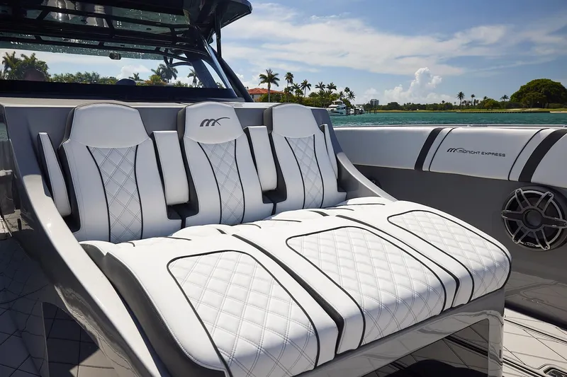 Devenzo Yacht Photos Pics Luxurious seating on 2022 Midnight Express 43 Open boat with quilted white upholstery.