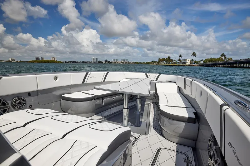 Devenzo Yacht Photos Pics 2022 Midnight Express 43 Open boat interior with luxurious seating and ocean view.