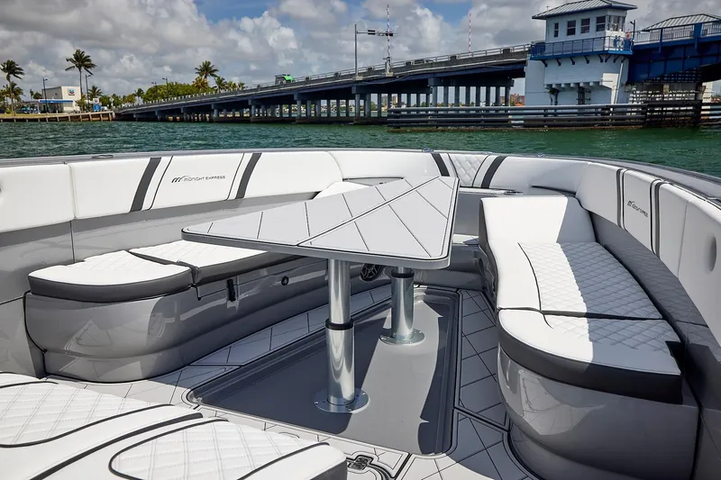 Devenzo Yacht Photos Pics Luxurious 2022 Midnight Express 43 Open boat interior with elegant seating and table.