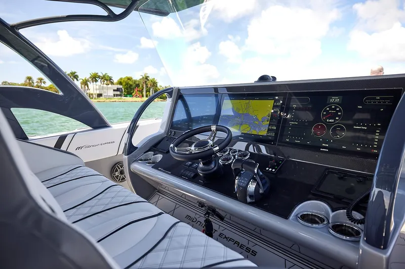 Devenzo Yacht Photos Pics Interior view of 2022 Midnight Express 43 Open boat cockpit with advanced navigation system.