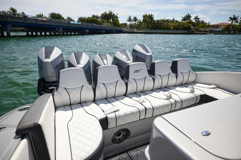 Devenzo Yacht Photos Pics 2022 Midnight Express 43 Open boat with multiple engines on a sunny day.