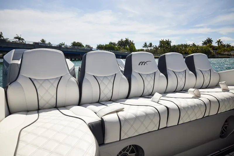 Devenzo Yacht Photos Pics Luxurious seating on 2022 Midnight Express 43 Open boat, featuring elegant white upholstery.