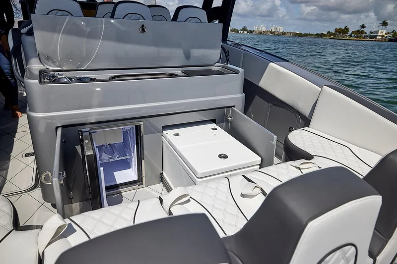 Devenzo Yacht Photos Pics 2022 Midnight Express 43 Open boat interior with seating and storage compartments.