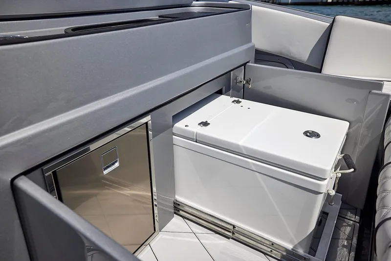 Devenzo Yacht Photos Pics 2022 Midnight Express 43 Open yacht interior with built-in cooler and storage compartment.