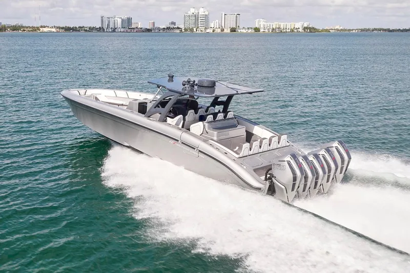 Devenzo Yacht Photos Pics 2022 Midnight Express 43 Open boat cruising on water with city skyline in background.