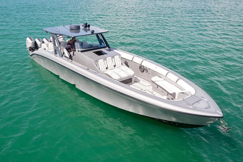 Devenzo Yacht Photos Pics 2022 Midnight Express 43 Open boat cruising on clear turquoise water.