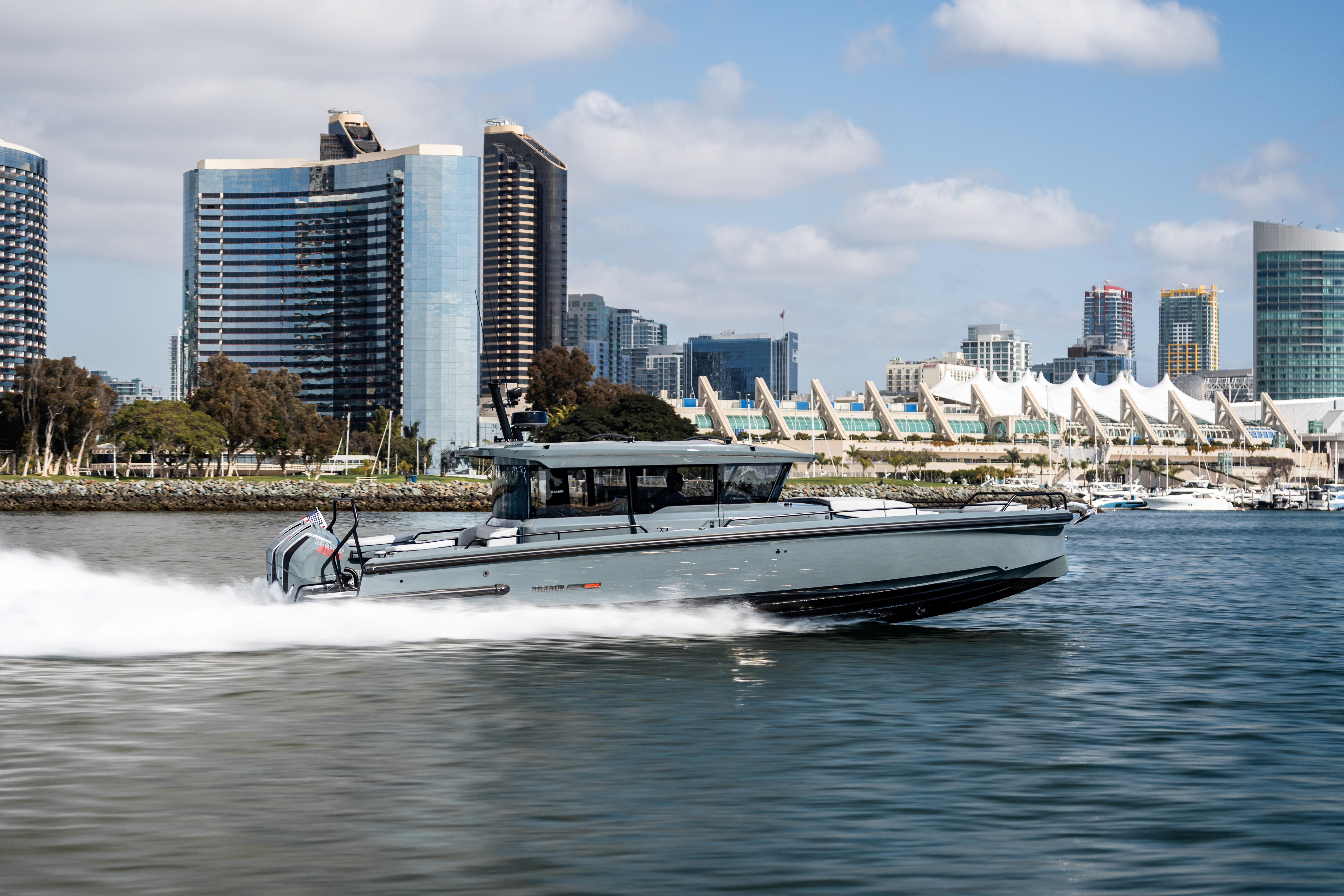 2025 BRABUS 1000 Cross Cabin Signature Edition yacht cruising near city skyline.