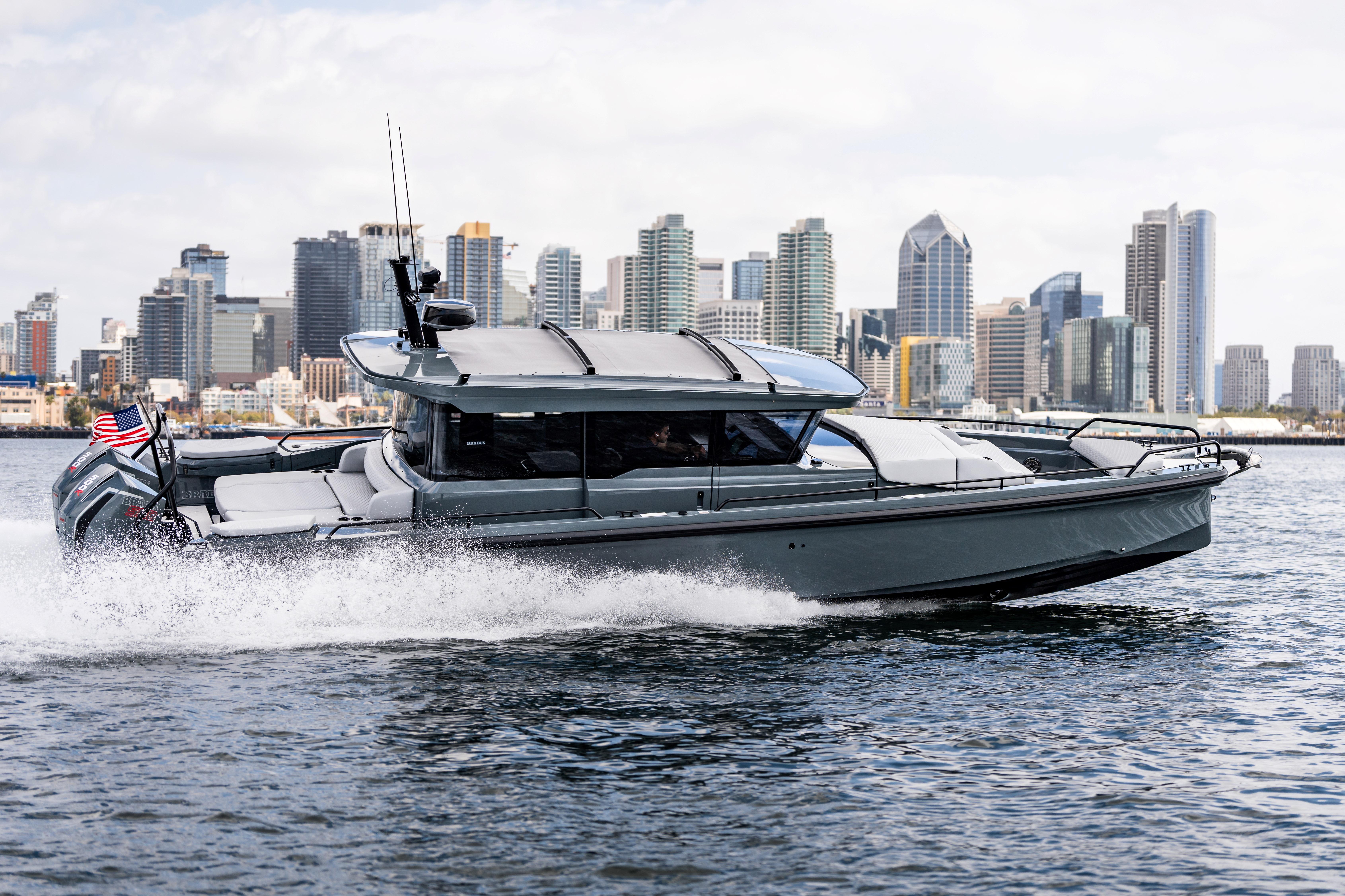 2025 BRABUS 1000 Cross Cabin Signature Edition yacht cruising near city skyline.