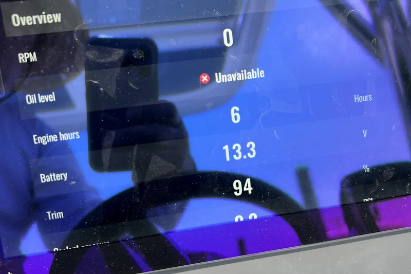  Yacht Photos Pics Close-up of Nimbus Tender 8 dashboard display showing engine metrics and oil level unavailable.