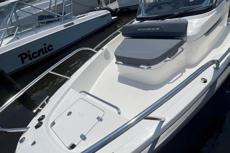  Yacht Photos Pics 2025 Nimbus Tender 8 boat with sleek design and comfortable seating.