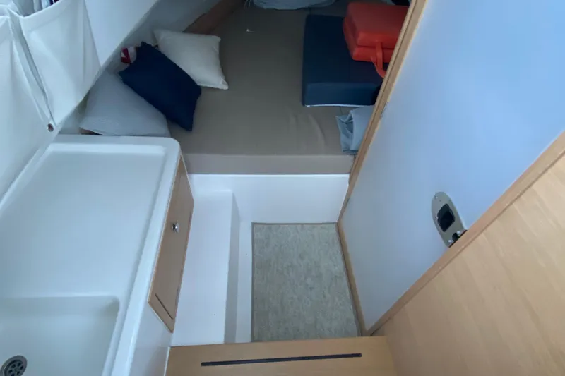  Yacht Photos Pics Interior of 2025 Nimbus Tender 8 boat with cozy cabin and compact sink area.