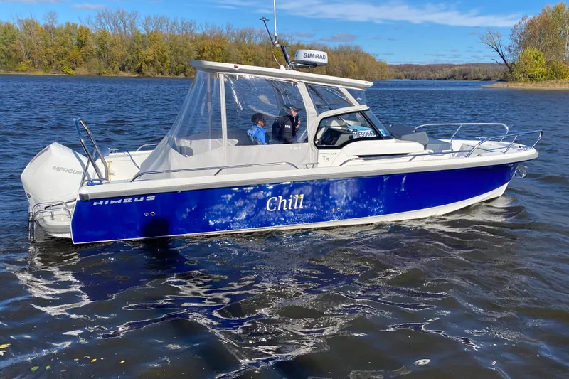  Yacht Photos Pics 2025 Nimbus Tender 8 boat named "Chill" cruising on a scenic lake.