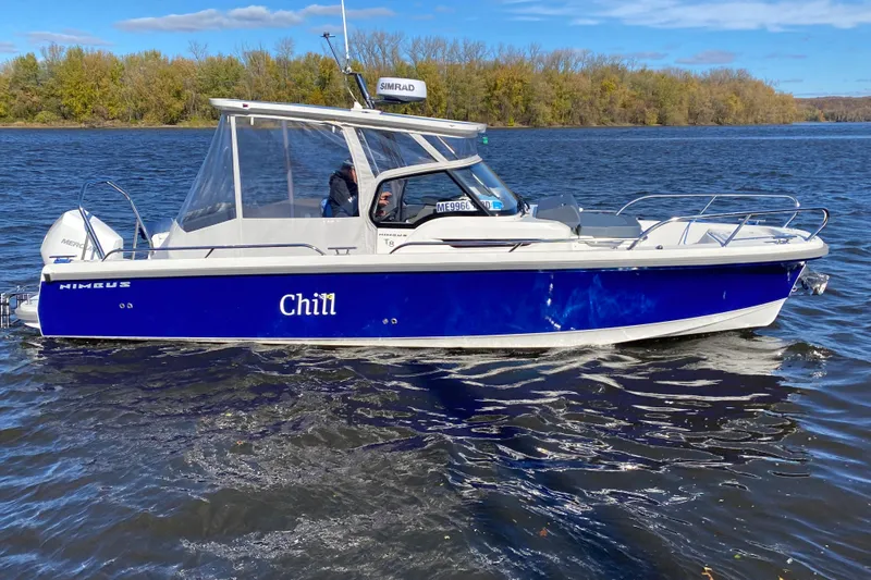  Yacht Photos Pics 2025 Nimbus Tender 8 boat named "Chill" cruising on a scenic river.