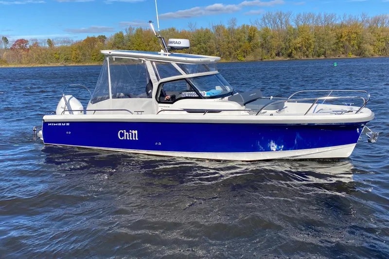  Yacht Photos Pics 2025 Nimbus Tender 8 boat named "Chill" on a scenic lake.