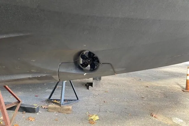  Yacht Photos Pics Bottom view of a 2025 Nimbus Tender 8 boat on stands, showcasing the propeller.