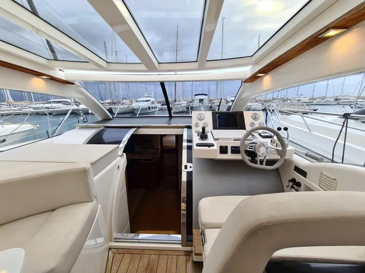  Yacht Photos Pics Luxurious 2010 Rio Yachts 46 cockpit with panoramic windows and modern helm station.