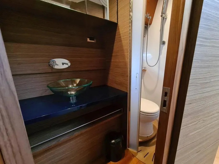  Yacht Photos Pics Modern bathroom in 2010 Rio Yachts 46, featuring glass sink and compact shower.
