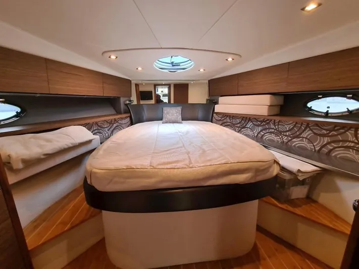  Yacht Photos Pics Luxurious bedroom interior of 2010 Rio Yachts 46 with modern design and cozy bed.