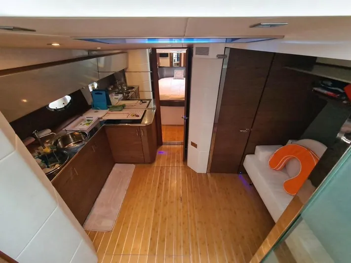  Yacht Photos Pics Interior of 2010 Rio Yachts 46 model with kitchen and seating area.
