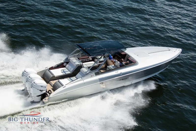  Yacht Photos Pics 2019 Donzi 41 GT speedboat cruising on water, Big Thunder Marine logo.