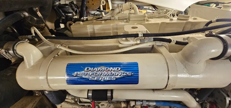 Sunbeam Yacht Photos Pics Engine compartment of a 2002 Pursuit 3800 Express with Diamond Performance Series label.