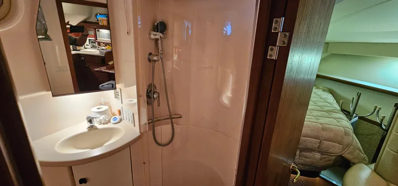 Sunbeam Yacht Photos Pics 2002 Pursuit 3800 Express yacht interior with shower and cozy cabin.