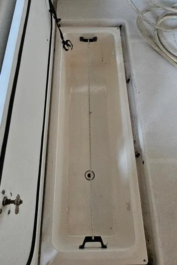 Sunbeam Yacht Photos Pics 2002 Pursuit 3800 Express boat storage compartment, open and empty.