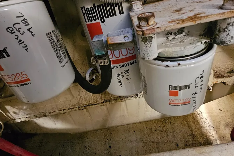 Sunbeam Yacht Photos Pics Fleetguard filters in a 2002 Pursuit 3800 Express engine compartment.