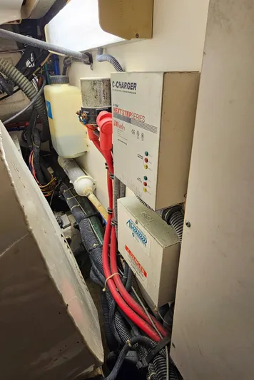 Sunbeam Yacht Photos Pics Engine room of a 2002 Pursuit 3800 Express with battery chargers and wiring.