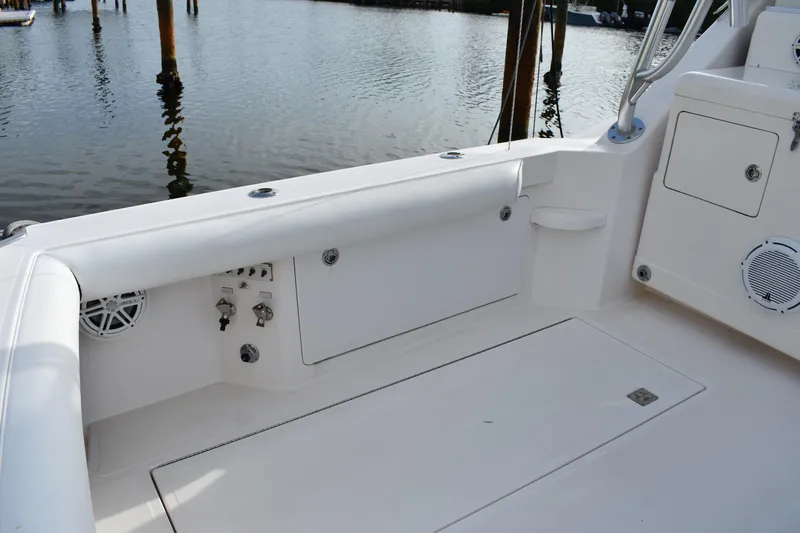 Kraken Yacht Photos Pics 2007 Cabo Express boat deck with storage compartments and water view.