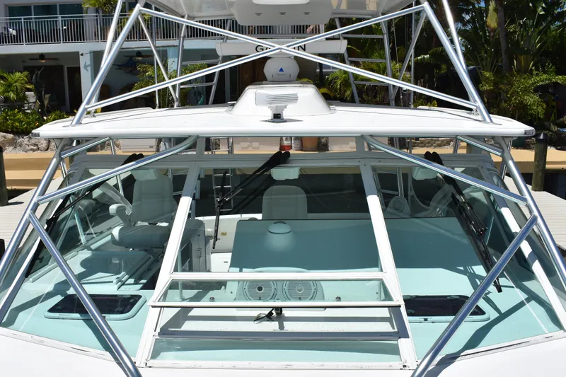 Kraken Yacht Photos Pics 2007 Cabo Express boat with sleek design and spacious cockpit at a marina.