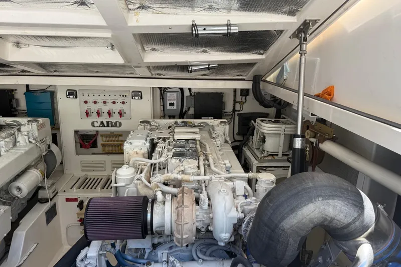 Kraken Yacht Photos Pics Engine room of a 2007 Cabo Express boat, showcasing detailed machinery and components.