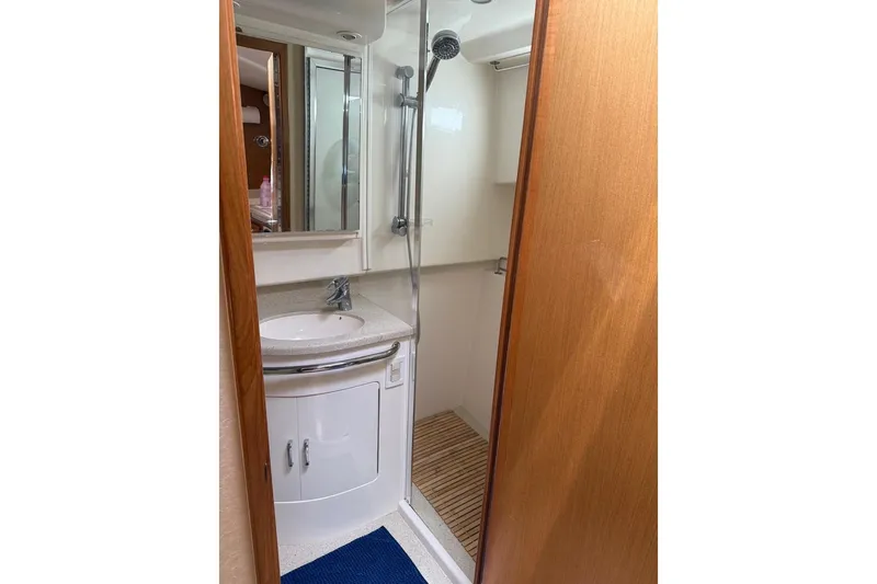 Kraken Yacht Photos Pics Compact bathroom in 2007 Cabo Express boat with shower and sink.