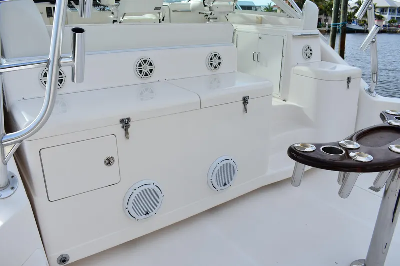 Kraken Yacht Photos Pics 2007 Cabo Express boat deck with storage compartments and rod holders.