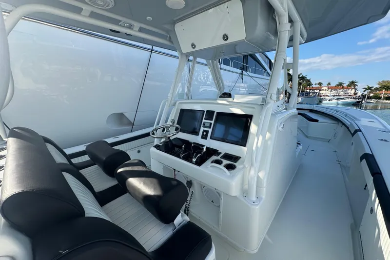  Yacht Photos Pics 2014 Yellowfin 39 Offshore boat interior with dual screens and seating.