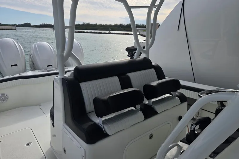  Yacht Photos Pics 2014 Yellowfin 39 Offshore boat interior with seating and dual engines.