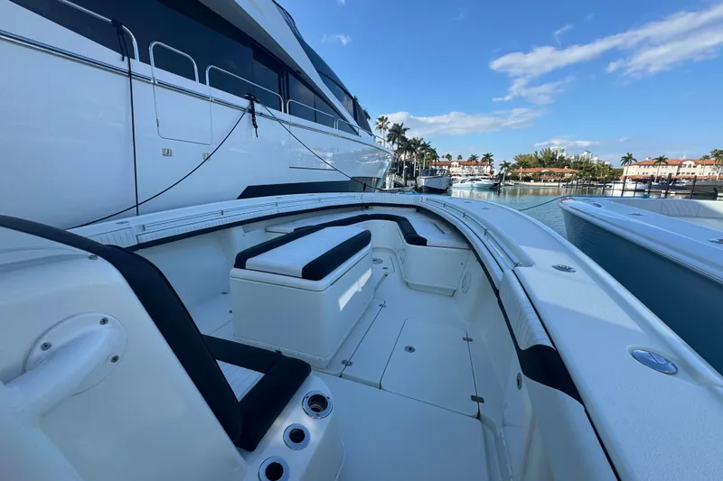  Yacht Photos Pics 2014 Yellowfin 39 Offshore boat docked, featuring spacious seating and sleek design.