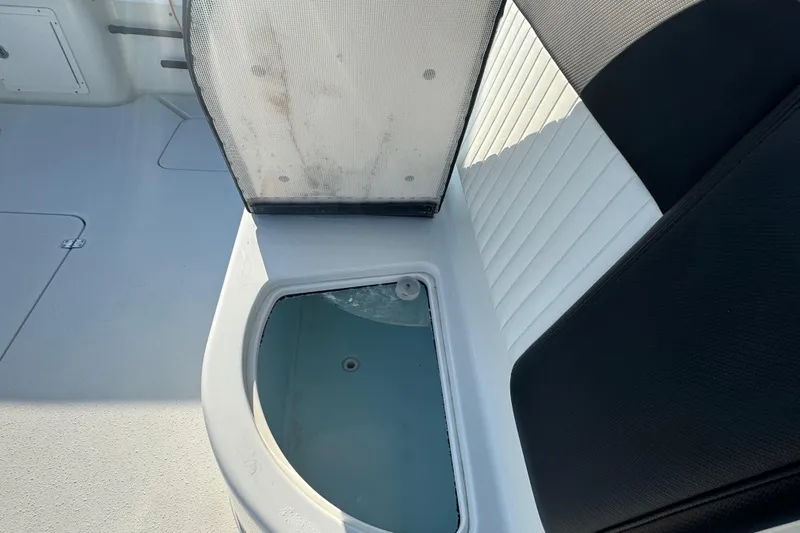  Yacht Photos Pics Open storage compartment on 2014 Yellowfin 39 Offshore boat with cushioned seating.