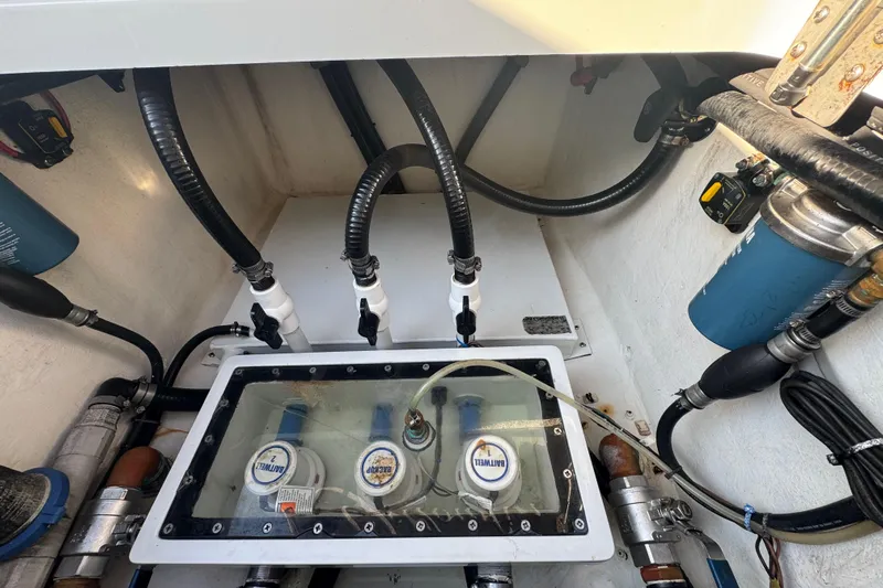  Yacht Photos Pics 2014 Yellowfin 39 Offshore boat engine compartment with hoses and filters.